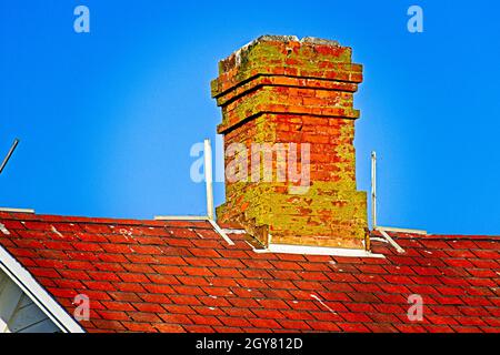 Chimney On Blue - An old mossy chimney in Port Angeles, Washington Stock Photo