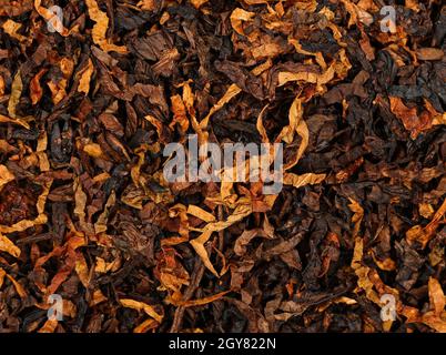 Close up background of ready rubbed long coarse cut pipe tobacco blend, elevated top view, directly above Stock Photo