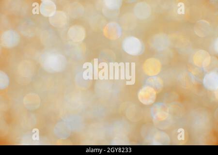 Abstract background of golden and silver bokeh defocused blurred lights and glitter sparkles Stock Photo