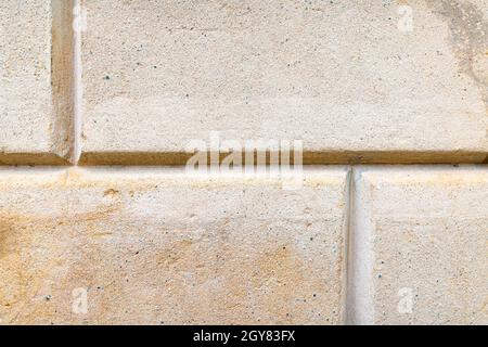 Background of yellow-orange brick stone wall texture photo Stock Photo