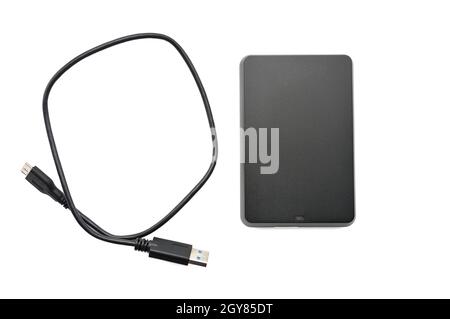 Portable hard drive for backing up various files on an isolated white background Stock Photo