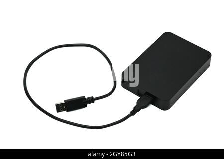 Portable hard drive for backing up various files on an isolated white background Stock Photo