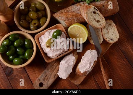 Taramosalata Greek spread Paste (pate) made of ground fish, shrimps, and caviar, served with lemon. Fish Egg Paste Tarama (white and rose), popular Is Stock Photo