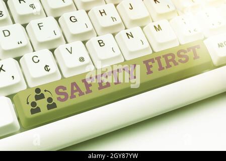 Conceptual display Safety First, Concept meaning Avoid any unnecessary risk Live Safely Be Careful Pay attention Typist Creating Company Documents, Ab Stock Photo