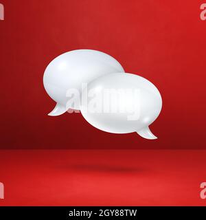 3D white speech bubbles isolated on red square background Stock Photo