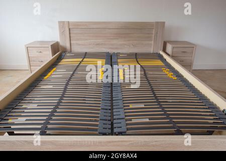 Slatted base, wooden element double bed frame close up in bedroom orthopedic interior Stock Photo