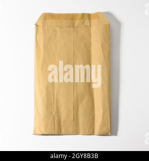 rectangular open brown kraft paper envelope on white background Stock Photo