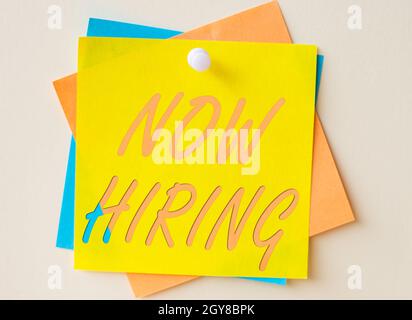 Text sign showing Now Hiring, Concept meaning an act of starting to employ someone qualified for the position Colorful Paper Notes Stacked Together An Stock Photo