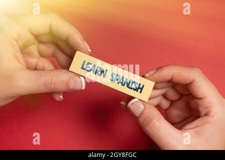 Sign displaying Learn Spanish, Concept meaning to train writing and speaking the national language of Spain Drafting New Contract Creating Agreement M Stock Photo