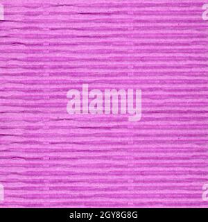 pink corrugated cardboard texture useful as a background Stock Photo