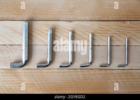 Set of hex keys on a wooden background Stock Photo