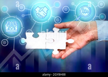 Hand Holding Jigsaw Puzzle Piece Unlocking New Futuristic Technologies. Stock Photo
