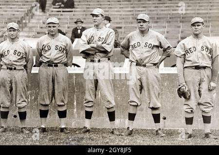 Babe Ruth in baseball uniform standing in dugout Stock Photo - Alamy