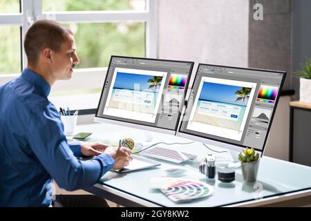 Graphic Web Designer Artist Using Computer To Design Stock Photo