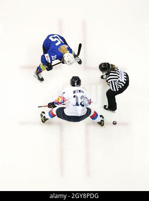 Republic of Korea’s Kim Hee-won and Slovenia’s Pia Pren (top) battle for the puck during the Beijing 2022 Olympics Women's Pre-Qualification Round Two Group F match at the Motorpoint Arena, Nottingham. Stock Photo