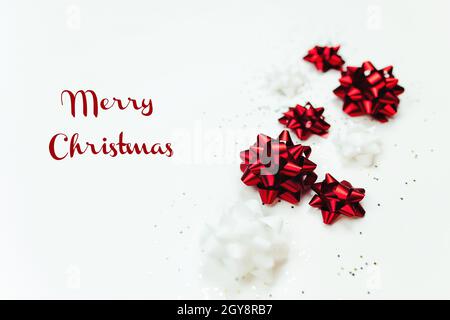 Christmas background with red and white bows and glitter. High quality photo Stock Photo