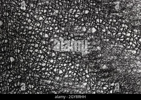 Dark grey lace abstract background. Dark background for design, social networks, text. Openwork, mesh, fabric background. Stock Photo