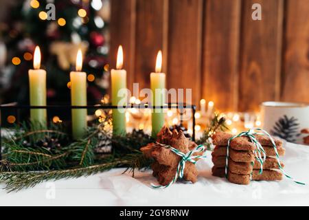 Christmas decorations with candles, fir branches and gingerbread. High quality photo Stock Photo