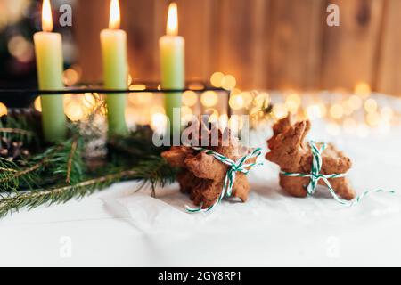 Christmas decorations with candles, fir branches and gingerbread. High quality photo Stock Photo