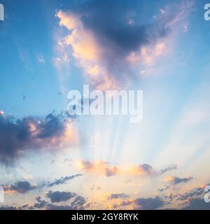 blue sunset sky illuminated by rays of sun in autumn evening Stock Photo