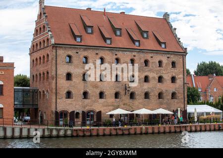 Gdansk, Poland - Sept 9, 2020: A restored medieval granary on the Olowianka island in the old town of Gdansk Stock Photo