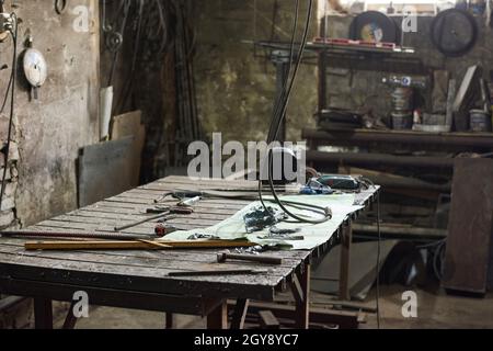 Image of table with work tools on it for work in the workshop Stock Photo
