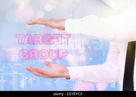 Hand writing sign Target Group, Word for Particular showing that an advertisement intended to reach to Inspirational business technology concept with Stock Photo