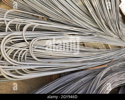 Steel rods or bars used to reinforce concrete, in warehouse Stock Photo