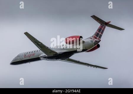 A Loganair Embraer ERJ-145 Regional Airliner taking off from Bristol Lulsgate Airport, England. Stock Photo