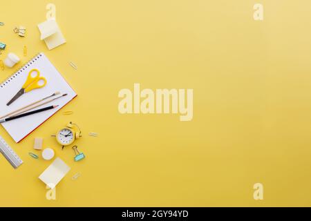Back to school conceptual flat lay with different office supply objects and copy space area for text. Concept for primary and secondary school pupil. Stock Photo