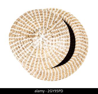 top view of moroccan wicker basket from seagrass with ajar lid isolated on white background Stock Photo