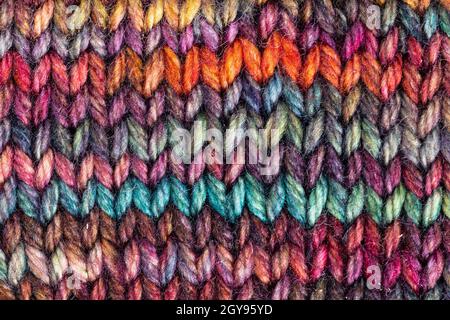 textile background - pied hand-knitted woolen fabric close up Stock Photo