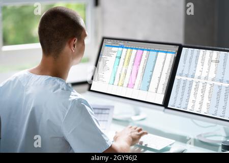 Account Manager In Office Coding Medical Bill Stock Photo