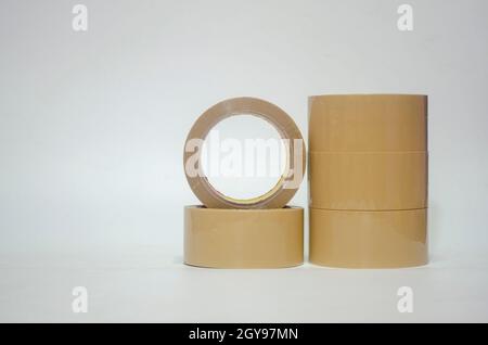 Brown tape on white background. Used for closing parcel boxes. Stock Photo