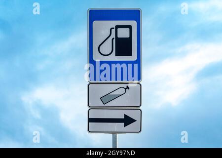 'LPG station' road sign on a metal pole, against the blue sky Stock Photo