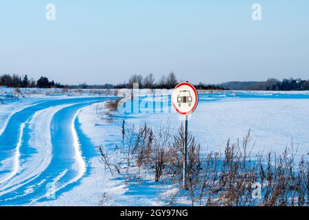 No cars allowed sign on winter field road Stock Photo