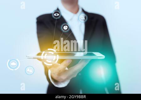 Lady In Suit Presenting Mobile Device With Futuristic Interface Tech. Stock Photo