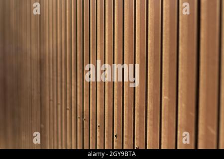 Brown steel fence. Construction fencing in detail. Repeating metal ribs. Stock Photo