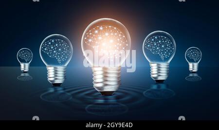 different Light bulb idea Many bulbs are arranged in a row and one of them is illuminated. Concept idea Stock Photo