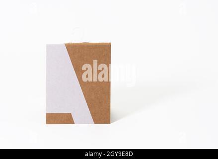 rectangular brown paper tag with sock hook on white background Stock Photo