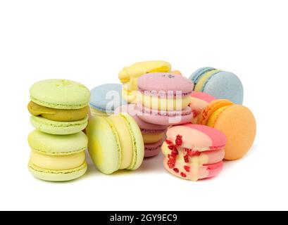 baked multicolored macarons with different flavors on white isolated background Stock Photo