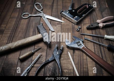 Set of different tools on vintage wood table background. Stock Photo