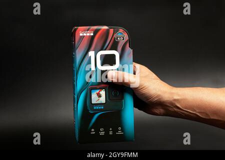 Moscow, Russia, October 06,2021 GoPro HERO10 Black Edition on black background hold in hand Stock Photo