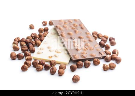 White and dark chocolate bars with hazelnuts isolated on white background. Stock Photo