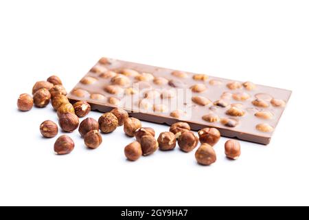Chocolate bar with hazelnuts isolated on white background. Stock Photo