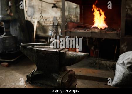 Image of workplace of blacksmith with work tools in the blacksmith shop Stock Photo