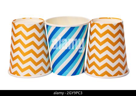 Paper disposable cups with colored pattern isolated on white background Stock Photo
