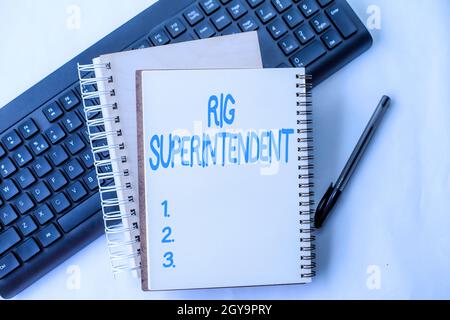 Conceptual display Rig Superintendent, Internet Concept Manage drilling operations to minimize rig down time Two Plain Lined Spiral Notebooks With Pen Stock Photo