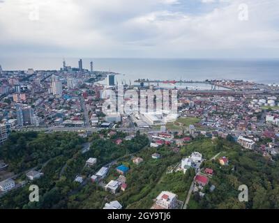 Drone view of the port, sea, city, private houses from the side of the mountain in Batumi. Stock Photo