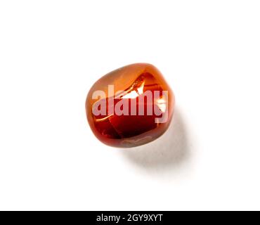 Carnelian agate gemstone isolated on a white background Stock Photo